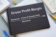© Vitalii Vodolazskyi - Notepad with Gross Profit margin gpm formula.