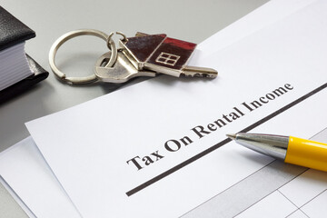 Sticker - Key and papers about tax on rental income.