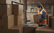 © StockPhotoPro - Warehouse worker lifting a heavy box