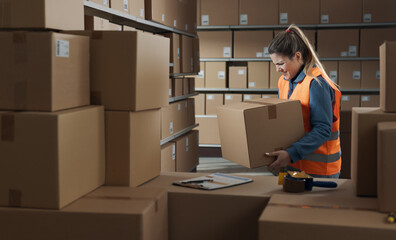 Warehouse worker lifting a heavy box