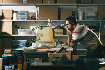 Vintage style tech guy working with a computer