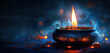 © Anna - Burning candle with aromatic incense creating serene ambiance in dark.