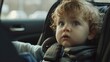 © Emin - Child sitting in a car seat