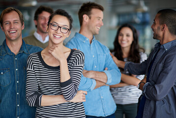 Wall Mural - Copywriter, portrait and funny with business people laughing together in creative office at work. Collaboration, happy and friends for men, woman or startup group joking and working as team support