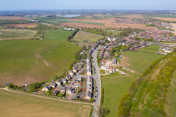 Canvas Print - Aerial photo of the village of Micklefield in the city of Leeds West Yorkshire UK showing a top down view of the houses in the village and main road going through the small village