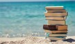 © Nadin Faust - stack of books on the beach with clear blue water background