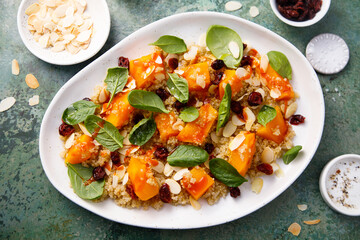 Wall Mural - Quinoa salad with pumpkin, spinach and cranberry