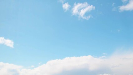 Wall Mural - Summer sky with white, cumulus clouds. Background with empty space for titles. Clouds frame copy space.