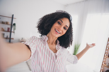 Wall Mural - Photo of adorable lovely woman recording video showing comfort flat cozy white light interior living room indoors