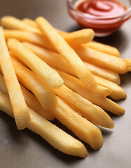 Wall Mural - French fries are thin strips of potatoes that are deep-fried until crispy and golden brown. They are a popular snack enjoyed worldwide for their crunchy exterior and soft interior. Food concept