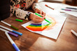 © Marko Geber - Little girl drawing a rainbow at home