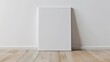 © Jelena - minimalist blank art canvas mockup on laminate floor white wall background