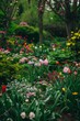 © tantawat - A vibrant spring garden in full bloom with a variety of flowers and lush greenery, capturing the beauty of nature