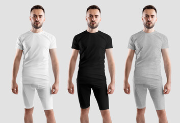 Wall Mural - Mockup of white, black, heather compensation suit on bearded man, t-shirt, shorts, isolated on background, front, set