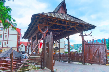 Poster - The covered bridge with wooden gate, Bukovel, Ukraine