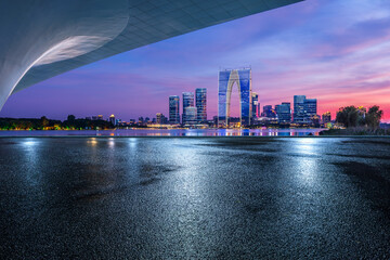 Wall Mural - Asphalt road square and bridge with modern city buildings scenery at night in Suzhou