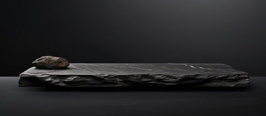 Poster - Isolated on a white background there is an empty top free space on a black natural stone counter The image is saved with a clipping path for product display. with copy space image