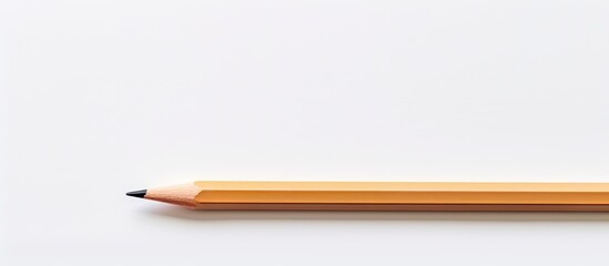 Aufkleber - A wooden pencil is positioned against a white blank paper background creating ample space for images or text