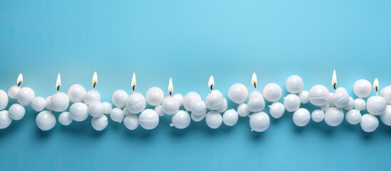 Poster - Blue background with copy space image of a birthday greeting card adorned with marshmallows and beads