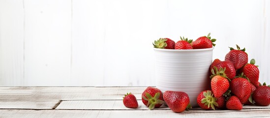 Aufkleber - Healthy food consisting of red strawberries arranged in a cup on a white washed wood surface with ample copy space image