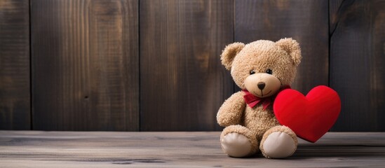 Poster - A cute teddy bear with a red heart surrounded by a wooden backdrop perfect for Valentine s Day Enhance your message with this copy space image