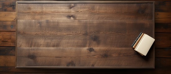 Aufkleber - From a bird s eye perspective there is a view of an old wooden desk where a blank notebook is placed providing ample empty space for an image or text