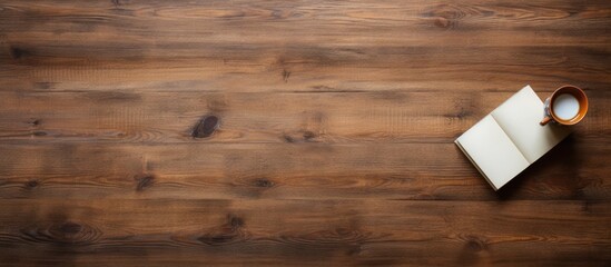 Aufkleber - From a bird s eye perspective there is a view of an old wooden desk where a blank notebook is placed providing ample empty space for an image or text