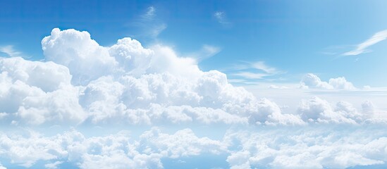 Aufkleber - Daytime sky with a subtle haze and fluffy white clouds offering plenty of empty space for creative copy or images
