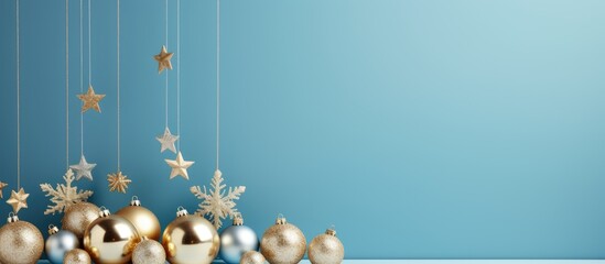 Poster - Copy space image of Christmas gold decorations on a light blue background creating a festive ambience Perfect for postcards or invitations capturing the essence of holiday and celebration Side view 18