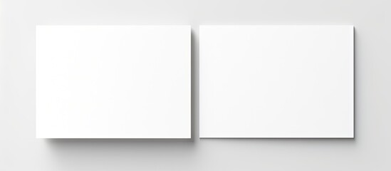 Poster - A hand is holding a white piece of paper isolated on a white background with ample copy space for the image