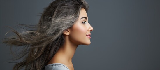Poster - Confident girl photographed in profile against a gray background with space for copy