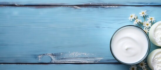 Poster - Celebrate Shavuot with dairy products on a blue wooden background The image is a mock up with copy space
