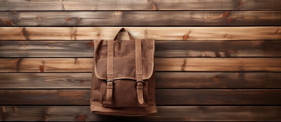 Wall Mural - Backpack made of canvas and leather hangs on a wooden wall with ample copy space image