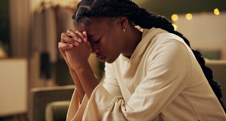 black girl, worship or pray on sofa in home for solace or devotion, spiritual connection and wellnes