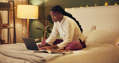 Leinwandbilder - Education, laptop and night with black woman in bedroom at home for distance learning or remote study. Computer, notebook and research with college or university person on bed of apartment in evening