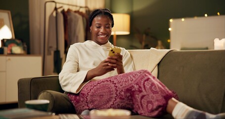 Poster - Black girl, happy and smartphone on sofa in home scrolling or online social media memes, videos and funny text. Woman, texting and mobile on couch to relax with entertainment, streaming and internet.