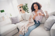 © deagreez - Photo of positive gorgeous woman dressed striped shirt enjoying hot tea indoors house apartment room