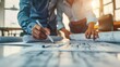 © Pravinrus - engineer and an architect reviewing blueprints and construction plans together at a bustling construction site