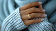 © Creative Habits - Hand with gold ring on cozy sweater