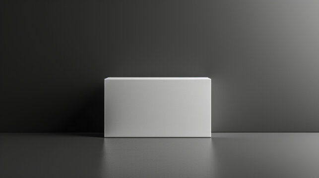 A white box is standing in a room with a grey wall