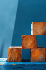 Poster - Artistic depiction of four wooden cubes arranged in an L-shape, creating a minimalist house against a solid blue backdrop,