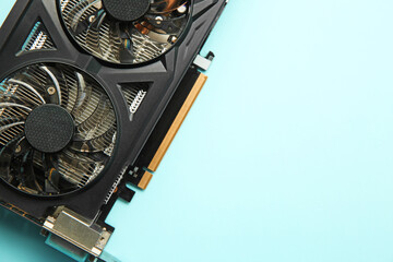 Poster - One graphics card on light blue background, top view. Space for text