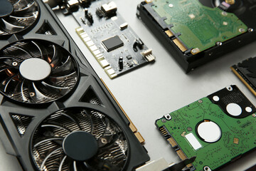 Poster - Graphics card and other computer hardware on gray background, closeup