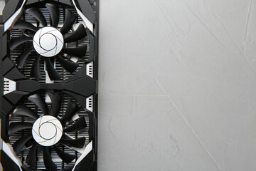 Poster - Computer graphics card on gray textured background, top view. Space for text