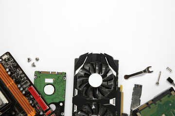 Poster - Graphics card and other computer hardware on white background, flat lay. Space for text