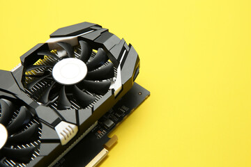 Fototapete - Computer graphics card on yellow background, closeup. Space for text