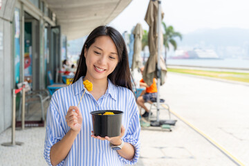 Poster - Woman eat Hong Kong local street food shumaii in Hong Kong city