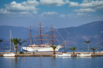 Sticker - Sailing ship and small white fishing boats in the harbor Nafplio Greece