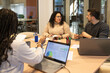 © ADDICTIVE STOCK - Collaborative friends team working in a coworking space