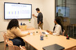 © ADDICTIVE STOCK - Team Collaboration During Coworking Presentation
